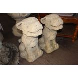 A pair of concrete Chinese temple dogs