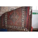 An approx 10' x 4' Eastern patterned rug (AF)