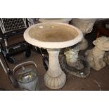 A large concrete bird bath