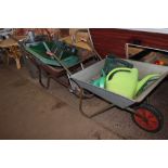Two wheel barrows and contents