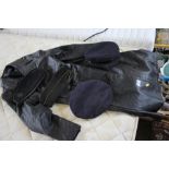 Four various military hats and a leather coat