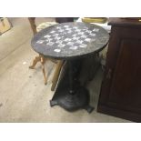 A Victorian papier maché circular tilt top occasio