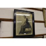 An ebonised framed black and white photographic pr