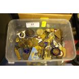 A tub of mixed lapel and pin badges