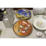 A pair of Japanese plates decorated with birds amo