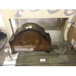 A 1930's oak cased three hole mantel clock