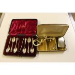 A cased set of six silver coffee spoons; and match