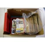 A box of collectors cards and postcards