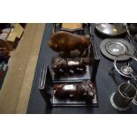 A pair of carved hardwood lion bookends; and a car