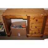 A pine knee hole desk fitted three drawers