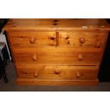 A modern pine chest fitted two short over two long