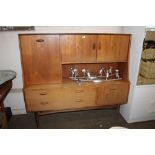 A teak sideboard fitted two drawers