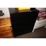 A black modern chest fitted four drawers