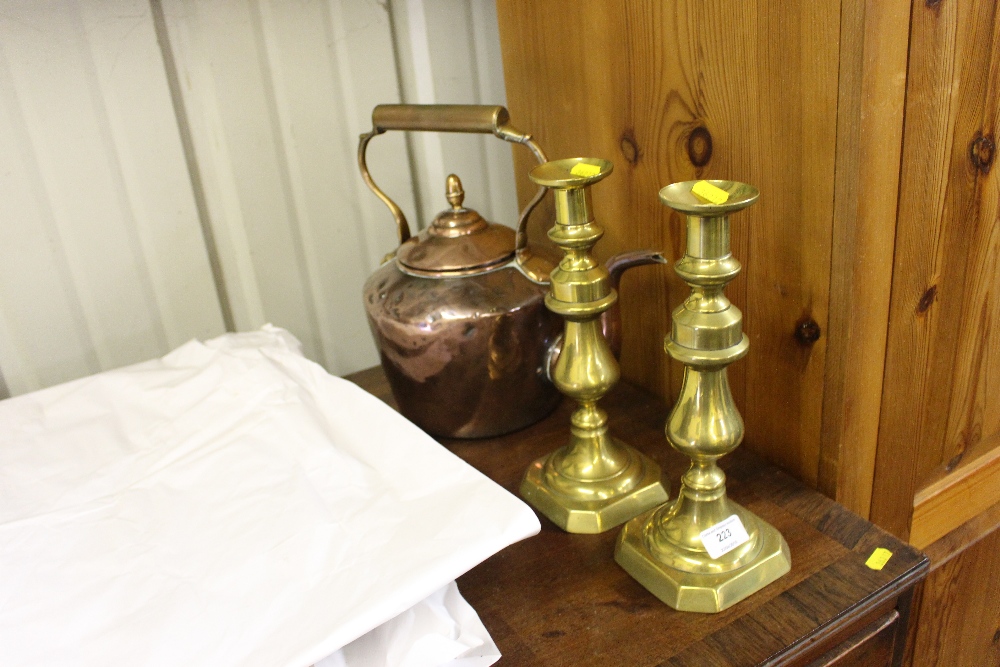 A pair of Victorian brass candlesticks; and a Vict