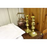 A pair of Victorian brass candlesticks; and a Vict