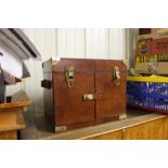 A leather and brass mounted picnic hamper