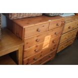 A modern pine chest fitted two short over four lon