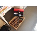 A box of various tools to include moulding planes