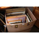 A box containing various pictures and prints