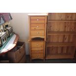 A pair of pine bedside chests fitted three drawers