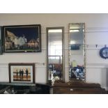 A gilt framed bevelled edge oblong wall mirror