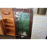 A mahogany glass fronted display cabinet