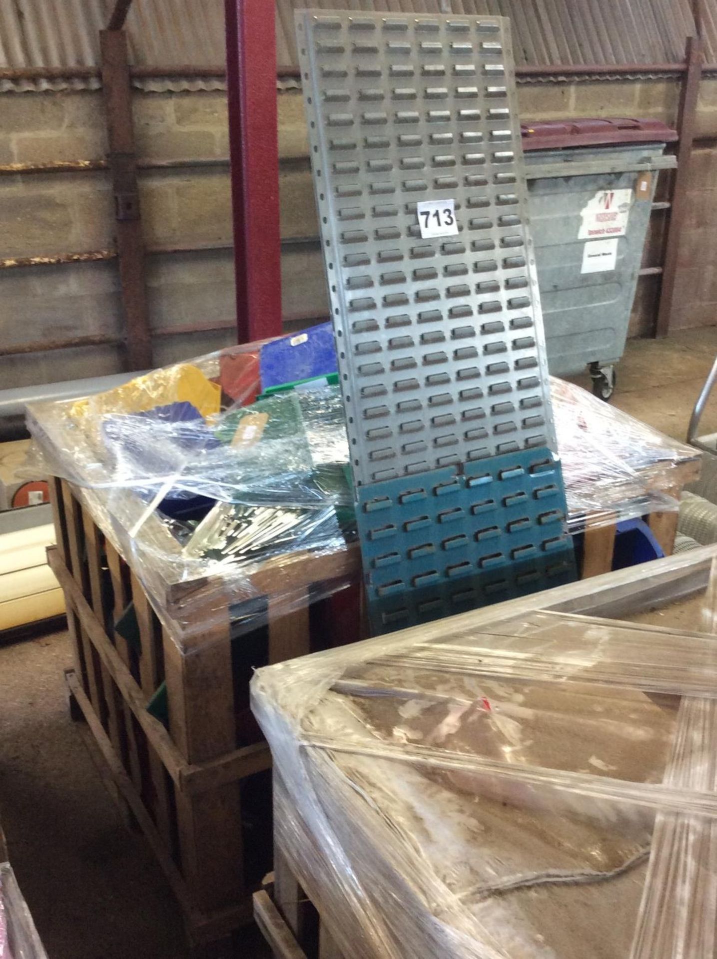 Pallet box of Dexian storage boxes and wall racking.