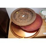 Two wooden trays and a copper tray