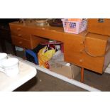 A mirrored back dressing table fitted seven drawer