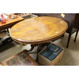 A Victorian mahogany oval topped dining table