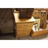 A wooden two drawer filing cabinet