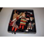 A tray containing six various dressed dolls