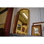 A gilt framed and bevel edged wall mirror mounted