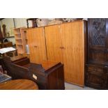 A Heals maple and mahogany gents wardrobe and mat