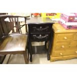 A French style black painted bedside table