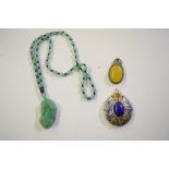 A jade coloured pendant; a bead necklace; and two