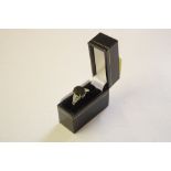 A black spinel and silver ring