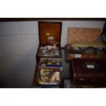 Three boxes containing miniature doll's; toy figur