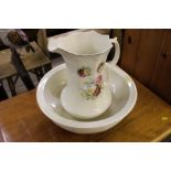 An Edwardian rose decorated wash jug and bowl