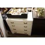 A white painted four drawer chest