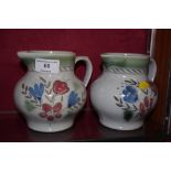 A pair of Scottish pottery jugs; and a Royal Doult