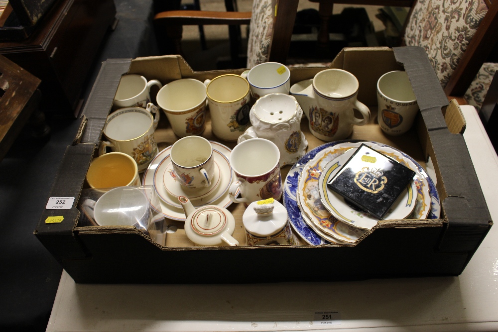 A box of mostly commemorative china