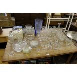 A large quantity of various drinking glasses, vase
