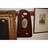A wooden photo frame made from a propeller contain