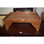 A hard wood bed tray