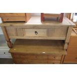 A pine coffee table fitted single drawer