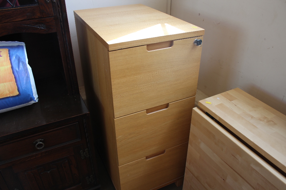 A hardwood filing chest fitted three drawers