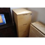 A hardwood filing chest fitted three drawers