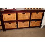 A wicker chest fitted six drawers