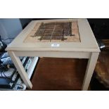 A teak tile topped coffee table